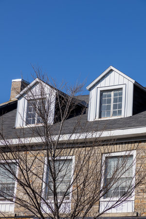 Dormer windows, attic of the house. Residential building.の写真素材