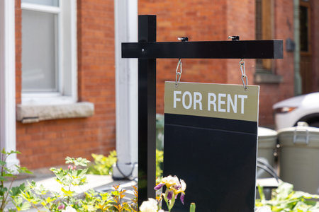For rent sign in front of a residential building. Real estate businessの写真素材