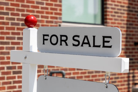 For sale sign in front of a house, property marketの写真素材