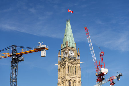 Parliament building Peace Tower under restoration with working cranes in Ottawa, Canada.の写真素材