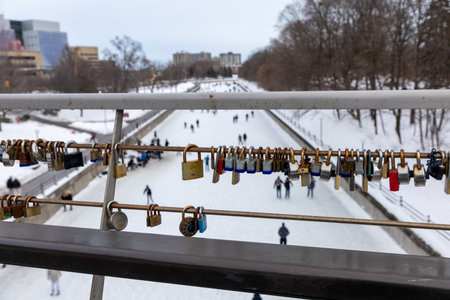 Ottawa, Canada - February 8, 2025: Locks on footbridge over skating ring on Rideau Canal in winterのeditorial素材