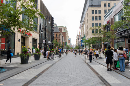 Montreal, Canada - July 5, 2025: Sainte-Catherine street, shopping district in downtown Montreal