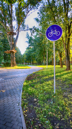 Bike sign in the autumn parkの写真素材