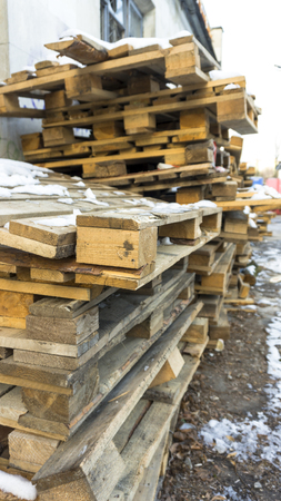 Wooden pallets, dirty old transport pallets outdoor.の写真素材