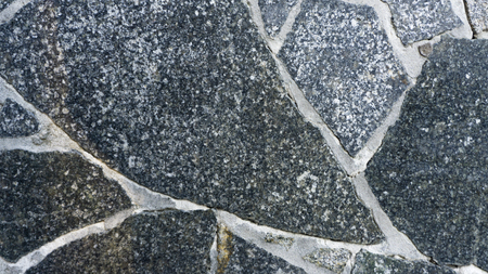 Natural stone granite background. Bright hard grey granite rock texture. Grey granite stone background.の写真素材