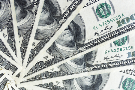 crolled stack of 100 dollar bills, close up banknoteの写真素材