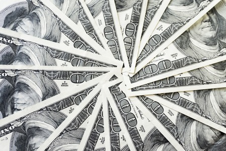 crolled stack of 100 dollar bills, close up banknoteの写真素材