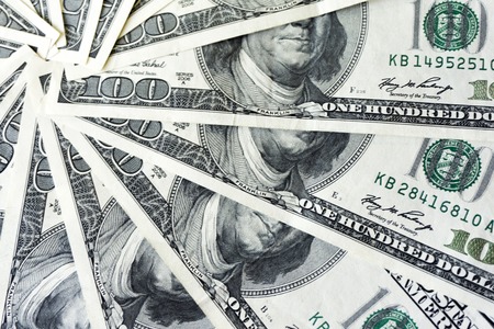 crolled stack of 100 dollar bills, close up banknoteの写真素材