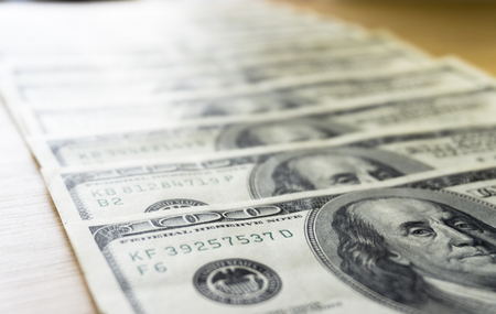 Fan of hundred dollar bills, close upの写真素材