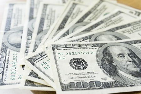 Fan of hundred dollar bills, close upの写真素材