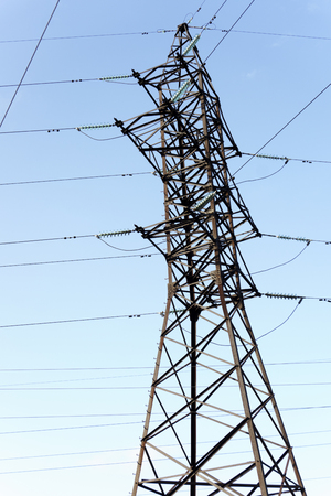 support of electro transmission lines against blue sky.の写真素材