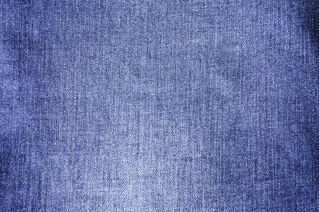 navy jeans fabric plain surface background, denim textile texture.の写真素材