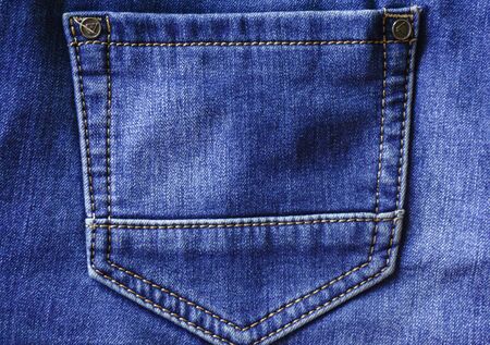 dark blue jeans denim back empty pocket texture background close up.の写真素材