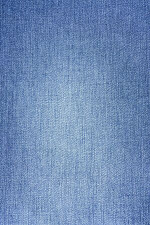 navy jeans fabric plain surface background, denim textile texture.の写真素材