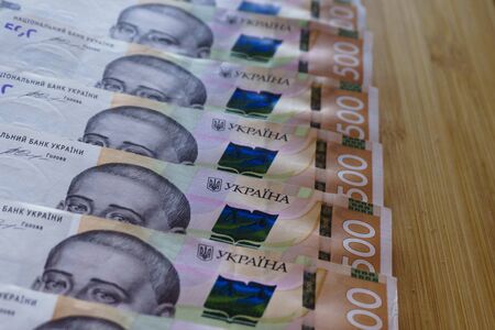 crolled stack cash money 500 hryvnia. Ukrainian national currency bills Money on table. Close up finance background. Corruption.の写真素材