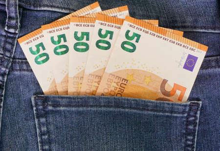 New banknotes fifty euro bills EUR in the back pocket of blue jeans. Money concept, Corruptionの写真素材