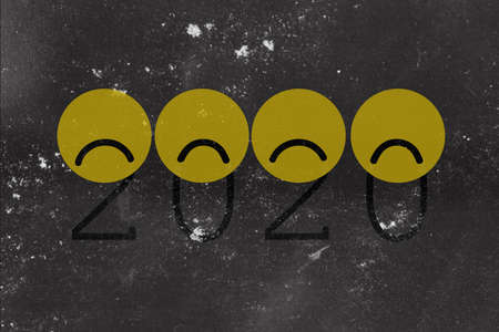 Sad 2020 year with loading icon. Progress bar almost reaching 2021 new year's eve with yellow sad smiles. black illustration with 2020.の写真素材