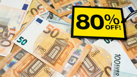 Yellow sale label on money euro background. Black friday sale. European money.の写真素材