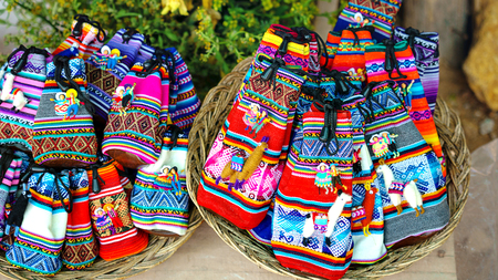 Peruvian dolls sale in souvenir shop of Cusco, Peru. Handmade. Close up souvenirs of Peru, in a traditional market. Selective focusの写真素材