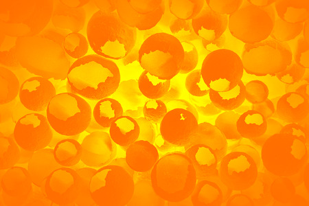 Cracked eggs pattern as colorful orange background. Top view, flat lay, selective focus. Easter creative minimal concept. Eggshell texture for art background.の写真素材