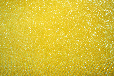 Blurred bokeh light yellow golden background, Christmas and New Year holidays background. Party concept. Festive holiday card bright backdrop. Defocused. Flat lay, top view, copy space.の写真素材