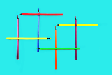 Back to school  with neon colors pencils on pastel blue backdrop.の写真素材
