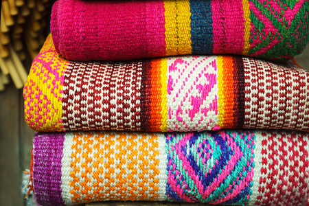 Peruvian traditional colorful native handicraft textile fabric at market in Machu Picchuの写真素材