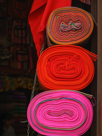 Peruvian traditional colourful native handicraft textile fabric at market in Machu Picchuの写真素材