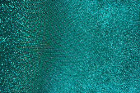 Blurred bokeh light blue green turquoise background, Christmas and New Year holidays background. Party concept. Festive holiday card bright backdrop. Defocused. Flat lay, top view, copy space.の写真素材