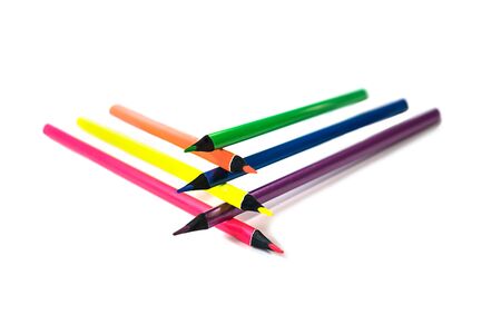 Back to school background with neon colors pencils on white backdrop, isolated. Flat lay, top view, copy space. Creative concept.の写真素材