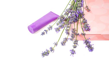 Cosmetic cream and lavender flowers, gift box with sweets on white background, isolated. Beauty, medical clinic, spa concept.の写真素材