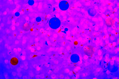 Abstract background with spheres. Multicolored bubbles on pink background with bokeh defocused lights and shadow. Illustration of balls textured as pattern. Modern trendy design confetti for holiday.の写真素材