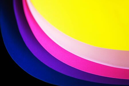 Trendy neon multicolor background from a arcs of cardboard different colors. Copy space. Back to school, party, celebration abstract concept. Minimal style.の写真素材