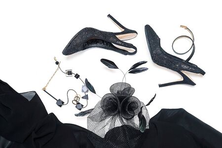 Halloween party female outfit collection accessories black on white background, shoes, cloth with skulls, hat, jewelry, make up, bag. Flat lay, top view, vertical, horizontal. Black Friday concept.の写真素材