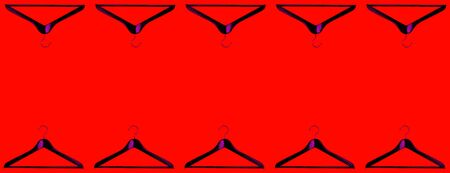 Fashion clothes hanger pattern on redの写真素材