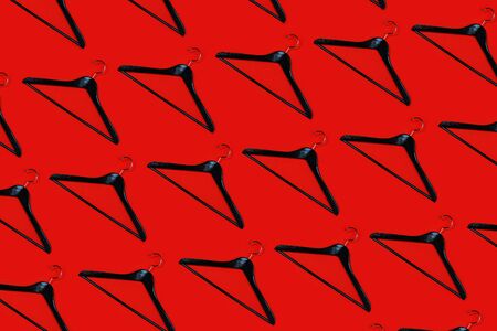 Fashion clothes hanger pattern on redの写真素材