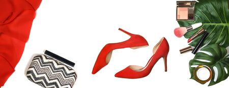 Top view party outfit red shoes, accessories makeup cosmetics, clutch, tropical monstera leaves on whiteの写真素材