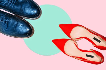 Valentines day concept with man and woman shoes on pastel pink and green aqua menthe background. Party, Fashion layout. Top view. Copy space for text. Classic Blue color 2020 inscription.の写真素材