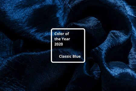 Blue color of the Year 2020 inscription. Faivorite colour of the New Year. Cloth colored in classic blue color. Concept for home design, interiors.の写真素材