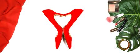 Top view party outfit: red shoes, accessories makeup cosmetics, clutch, tropical monstera leaves on white background isolated. Party Valentines Day Christmas New Year wedding dinner layout. Flat lay.の写真素材