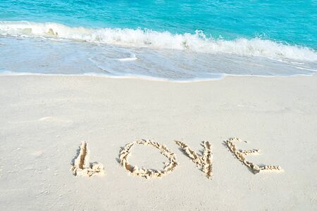 Love on the sea sand. Love concept for Valentine Day or summer vacation.の写真素材