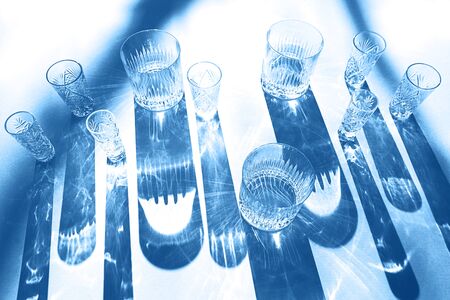 Trendy color pattern made with glasses and shadows on classic blue background. Classic Blue color of the Year 2020 inscription.の写真素材