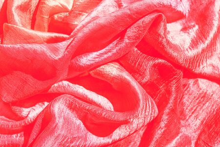 Red silk textures background. Selective focus. Valentine's day Party concept. Copy space, top view, flat lay.の写真素材