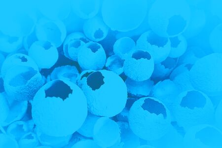 Cracked eggs pattern on classic blue color background. Top view, flat lay, selective focus. Easter creative minimal concept. Classic Blue color of the Year 2020 inscription.の写真素材