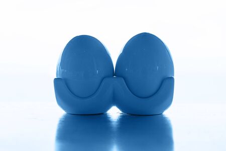 Easter eggs on nature classic blue background. Ceramic eggs. Spring holidays concept. Selective focus.の写真素材
