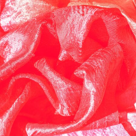 Red silk textures background. Selective focus. Valentine's day Party concept. Copy space, top view, flat lay.の写真素材