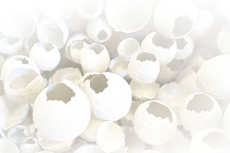 Cracked eggs pattern as white and gray background. Top view, flat lay, selective focus. Easter creative minimal concept. Eggshell texture for art background.の写真素材