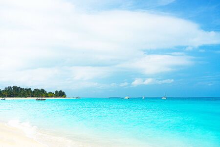Panoramic view of a beautiful sunny day on sandy beach in the Maldives. Tropical travel concept.の写真素材