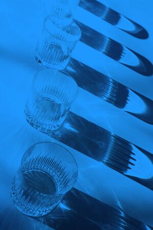 Trendy color pattern made with glasses and shadows on classic blue background. Classic Blue color of the Year 2020 inscription.の写真素材