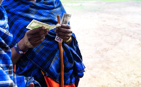 African man counting money, counting dollars. Close up.の写真素材